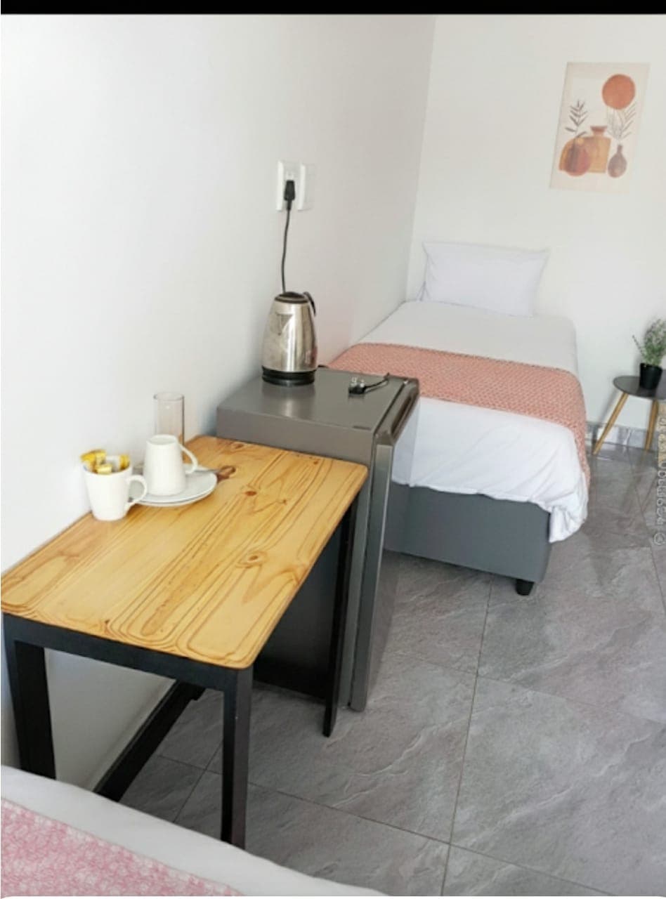 Triple room workspace with kettle and amenities